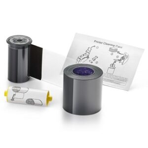 A vintage film developing kit with film canister and chemicals.